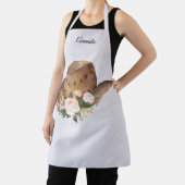 茶色の女性のカーボーイハットとピンクの花 エプロン (インサイチュ)