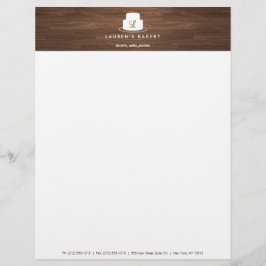 茶色の木目に白いケーキのモノグラムのロゴ レターヘッド