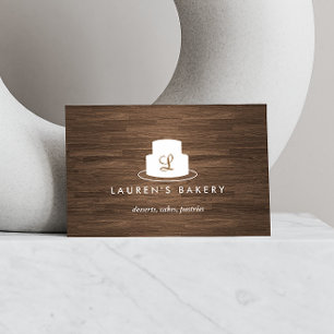 茶色の木目に白いケーキのモノグラムのロゴ 名刺