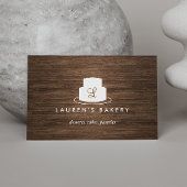 茶色の木目に白いケーキのモノグラムのロゴ 名刺