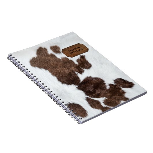 茶色の白い斑点フェイクのある牛の毛皮と革 ノートブック (右側)