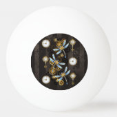 茶色の背景にスチームパンクストライプのトンボ 卓球ボール (正面)