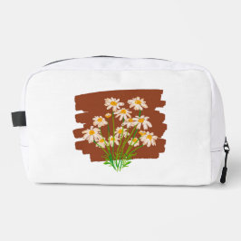 茶色の背景に描かれた牧歌的な花のデザイン ドップキット