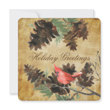 茶色の背景に赤いカーディナルと松ぼっくり ホリデーカード