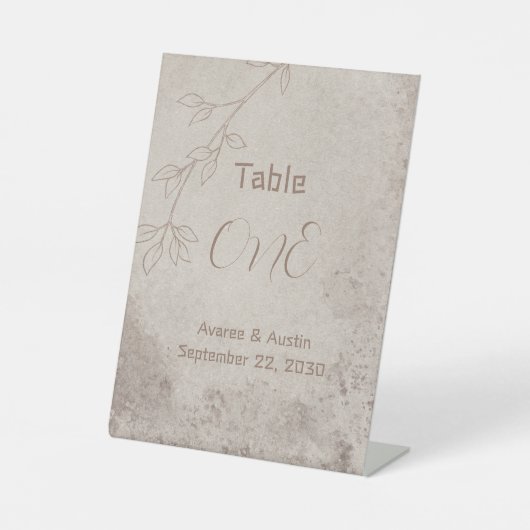 茶色の花柄の背景に茶色のテキスト 台座サイン (正面)