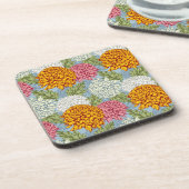 菊が付いている優秀なパターン コースター (左側)