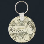 葉に囲まれた美しいヴィンテージの白い鳩 キーホルダー<br><div class="desc">美しいヴィンテージの白い鳩の葉の運平和の旗の黒と白に囲まれた</div>
