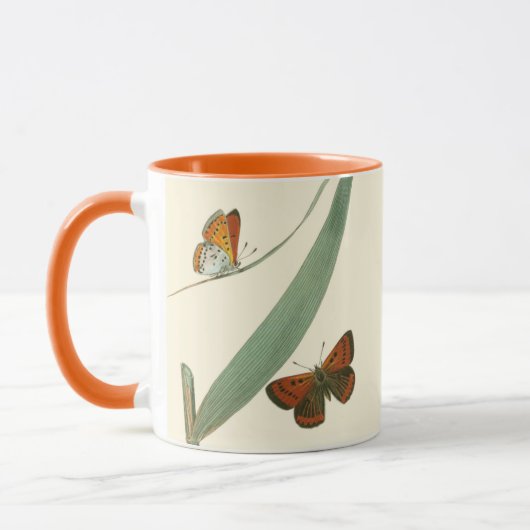 葉カラフルを舞うのまわりに蝶 マグカップ (左)