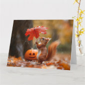 葉傘がかわいいリス – 秋の雨 カード (黄色い花)