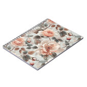 薄い灰色に灰色葉の花を付けたクリーム ノートブック (左側)