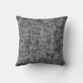 薄く斑点のある灰色と黒の肌をした クッション (裏面)