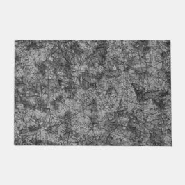 薄く斑点のある灰色と黒の肌をした ドアマット