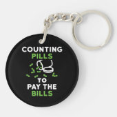 薬おもしろい薬師による手形の支払 キーホルダー (裏面)