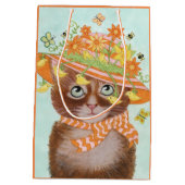 蝶が付いているイースターボンネットのイースター猫 ミディアムペーパーバッグ (裏面)