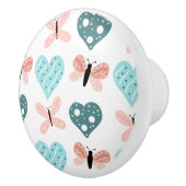 蝶とハートティール（緑がかった色）とピンク セラミックノブ (右)