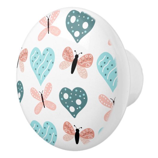 蝶とハートティール（緑がかった色）とピンク セラミックノブ (右)