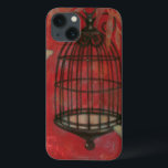 蝶と装飾的な鳥かご iPhone 13ケース<br><div class="desc">ノーマン淡い色の・ワイアのまわりにットによるこ絵画の鳥の上に2羽の蝶が浮かぶ。葉つる鳥の上に乗って、すべて深紅の背景にある。今日このプリントを注文！</div>