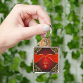 装飾的なコーナーを持つ美しいクリスマスボール キーホルダー (手)