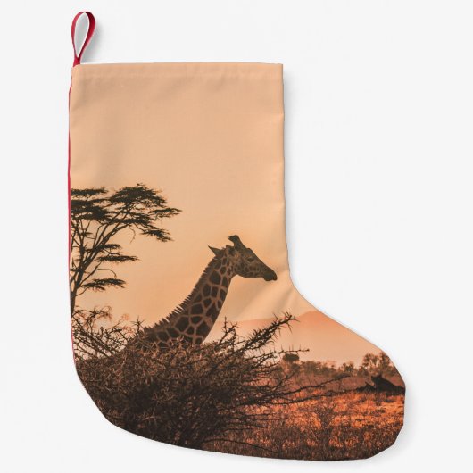 褐色の草原に生える黒と白のキリン スモールクリスマスストッキング (正面)