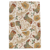 西クリスマスブーツと帽子のパターン ミディアムペーパーバッグ (正面)