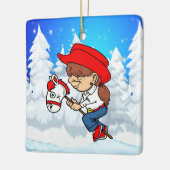 西女性のカーボーイキッドオンスティックホース冬のシーンSq セラミックオーナメント (左)