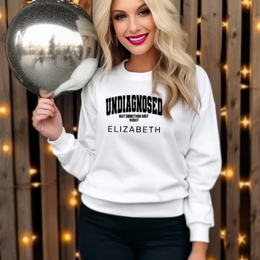 診断されていないが、何か右の白と黒 スウェットシャツ