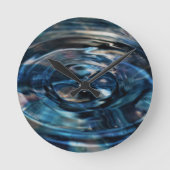 詩人Adiela Akooによる水時計 ラウンド壁時計 (正面)