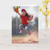 誕生日の少女がソフトボールを取りに飛び跳ぶ カード (黄色い花)