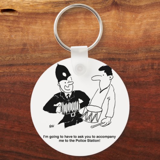 警官頼が同行する。漫画おもしろい キーホルダー (正面)