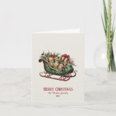 贈り物と緑のあるヴィンテージクリスマスそり カード (正面)