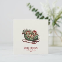 贈り物と緑のあるヴィンテージクリスマスそり