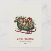 贈り物と緑のあるヴィンテージクリスマスそり シーズンポストカード (正面)