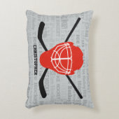 赤いアイスホッケーのヘルメットおよび棒のタイポグラフィ アクセントクッション (正面(垂直))