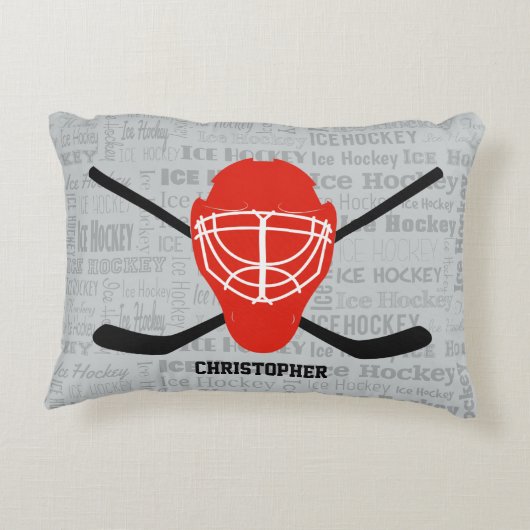 赤いアイスホッケーのヘルメットおよび棒のタイポグラフィ アクセントクッション (裏面)