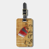 赤いアコーディオン、黒いメモ、金ゴールドの背景 ラゲッジタグ (正面縦)