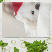 赤いクリスマスの帽子をかぶったかわいい白犬 キッチンタオル (折り畳み)