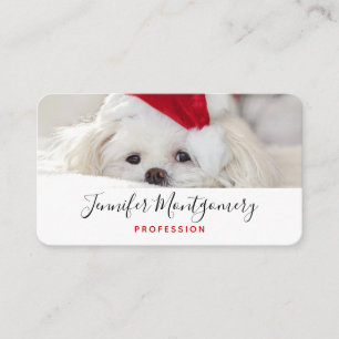 赤いクリスマスの帽子をかぶったかわいい白犬 名刺