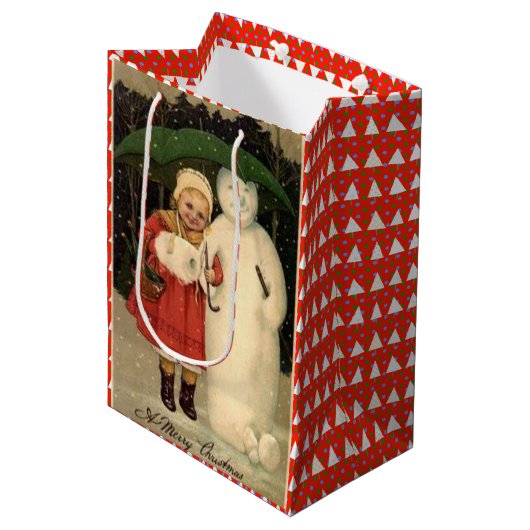 赤いコートを着た女の子と雪だるま，白いクリスマス ミディアムペーパーバッグ (正面アングル)
