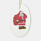 赤いサンタクロースに抱き枕とメガネ セラミックオーナメント (左)
