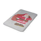 赤いサンタクロースに抱き枕とメガネ バスマット (アングル)