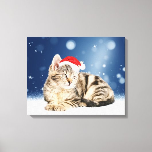赤いサンタ帽をかぶった可愛い猫クリスマス雪 キャンバスプリント (正面)
