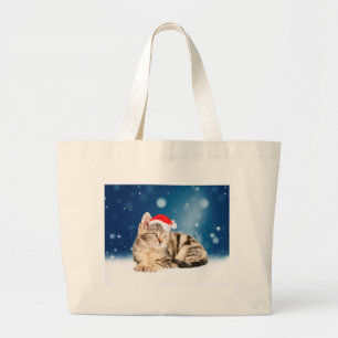赤いサンタ帽を被ったかわいい猫　クリスマスの雪 ラージトートバッグ