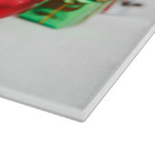 赤いサンタ帽子のクリスマスオーナメントを着た猫 カッティングボード (角)