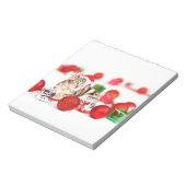 赤いサンタ帽子のクリスマスオーナメントを着た猫 ノートパッド (回転)