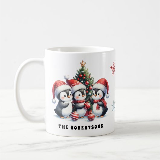 赤いサンタ帽子の可愛いペンギン家族のクリスマス コーヒーマグカップ (左)