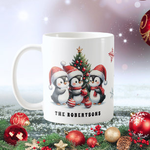 赤いサンタ帽子の可愛いペンギン家族のクリスマス コーヒーマグカップ