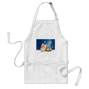 赤いサンタ帽子をかぶったクリスマスの雪の可愛い猫 スタンダードエプロン