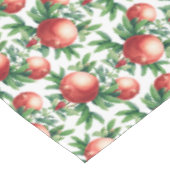 赤いザクロの果実と緑葉の テーブルクロス (アングル)