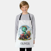 赤いトラクターを運転するかわいいトレックス恐竜 エプロン (着用した状態)