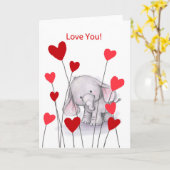 赤いハートを持つ小さくかわいい象は、愛します カード (黄色い花)
